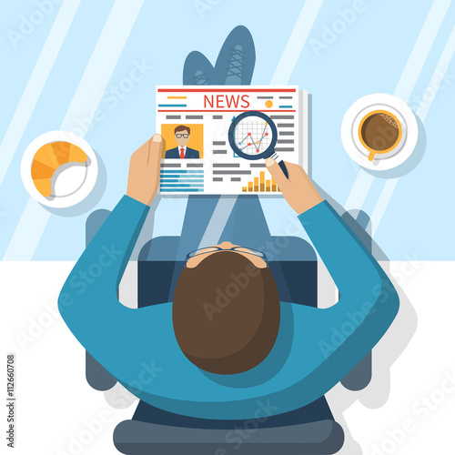 Businessman reading newspaper