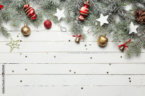 Bild auf Leinwand Christmas or New Year decoration background: fur-tree branches, colorful glass b