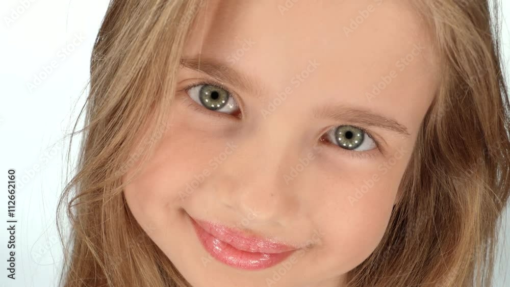 Face close-up of a teenage blonde on a white background Face close-up of a teenage blonde on a white background