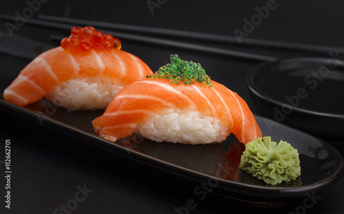 Sushi nigiri over black background