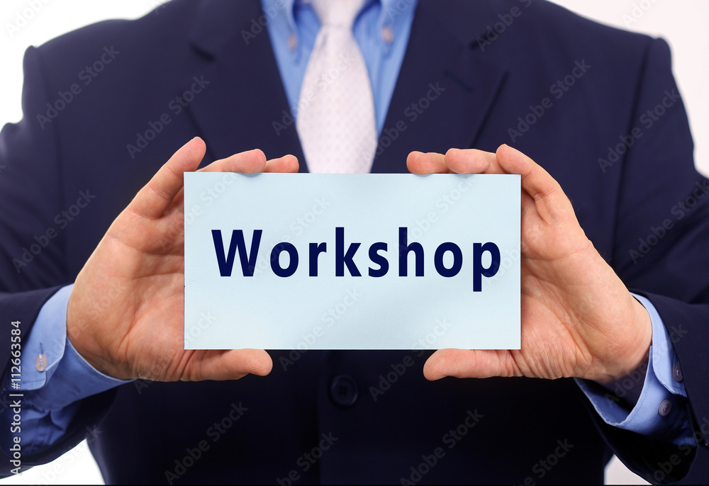Business man hold paper workshop text on it Business man hold paper workshop text on it