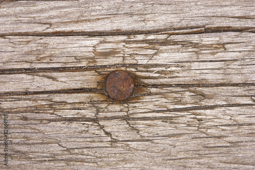 Rusty nail in a board