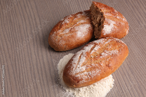 Bread flour on wooden background