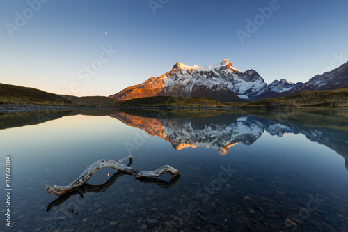 Paine Grande reflected in a small cove of  Lago Nordenskj_ld at sunrise