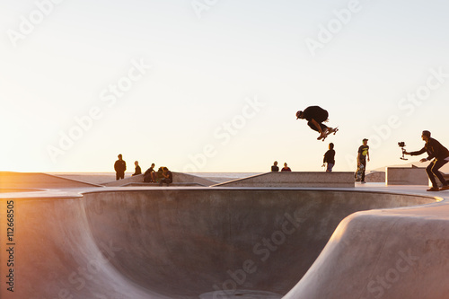 Action at a skateboarding park photo