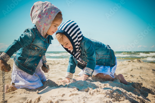 two girls playing on the beach © superelaks