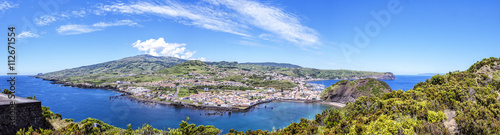 View of the town of with the bay on the background of green hills and blue sky, to the Azores