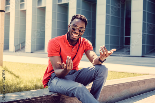 Portrait of smiling casual black man in red tshirt.