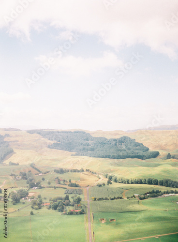 Rural scene with fields and hilld, Queenstown, South Island, New Zealand photo