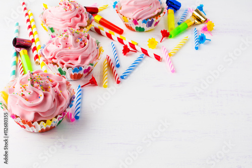 Birthday background with pink cupcakes
