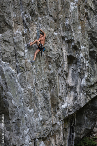 Rock Climber climbing a steep cliff. Taken near Squamish, British Columbia, Canada