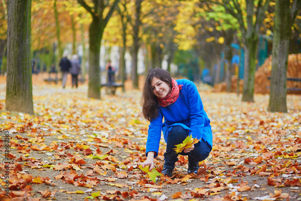 Beautiful young tourist in Paris on a fall day