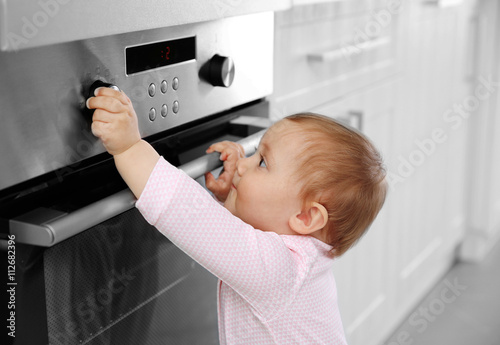 Little child playing with e...