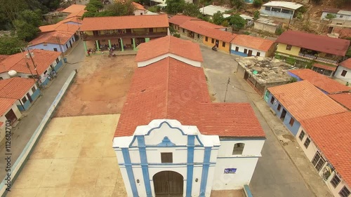 Aerial view of the Church and main cocoa drying plaza at Chuao, Venezuela. Chuao is best known to grow the best and finest cocoa in the world and a very popular beach in the central coast of Venezuela