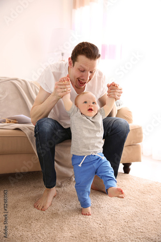 Young father having fun wit...