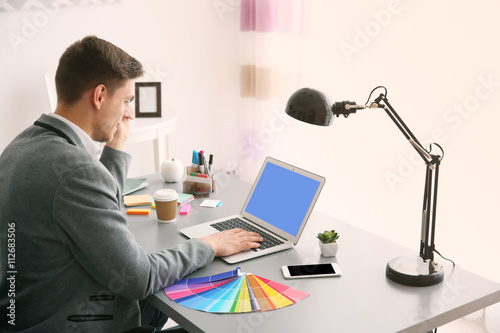 Man working at computer at ...