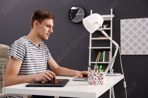 Man working at computer at ...