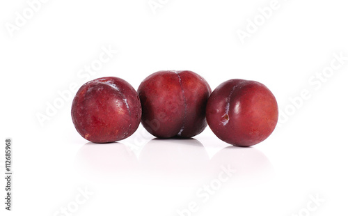 Plums close up isolated on white background