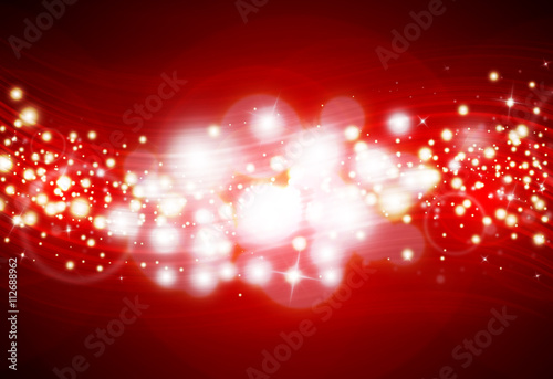 Red glitter sparkle defocused rays lights bokeh abstract sparkling background.