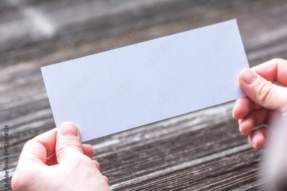 Obraz premium hands with white blank paper