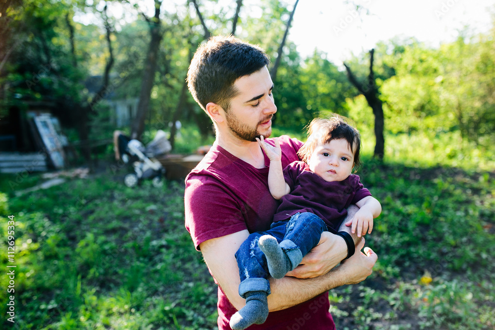 young family with a child on the nature