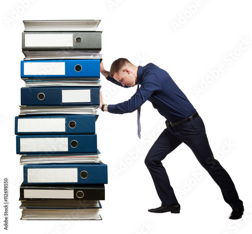 Businessman and a stack of office folders, concept