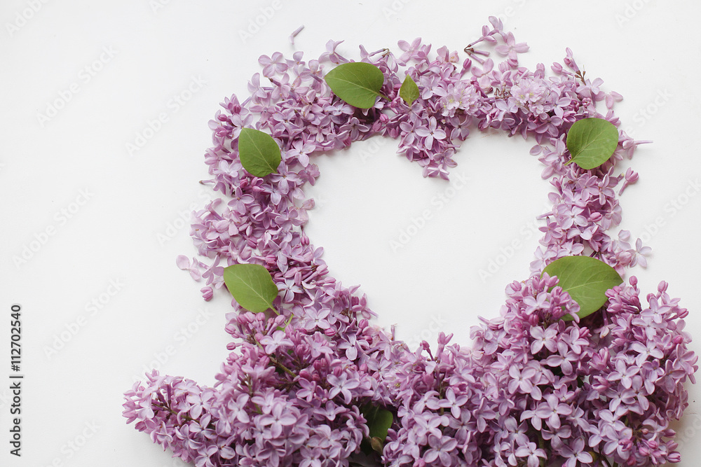 Heart from flowers of a lilac on a white background