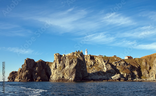 lighthouse on the rocky coast © salman2