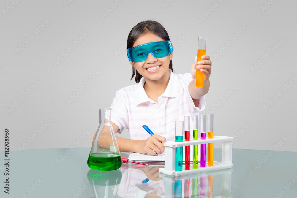 Little asian girl is making science experiments education