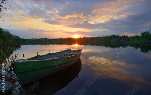 fisherman boat at sunset time