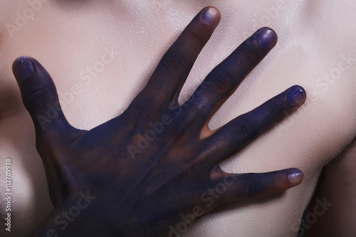 body art tinted black man's hands photo