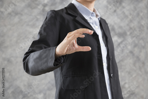 gesture of businesswoman hand holding something