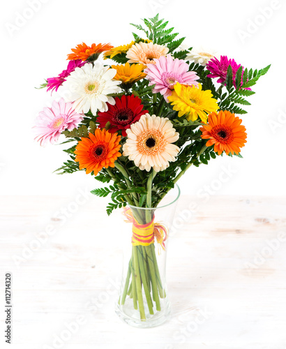 colorful bouquet of gerberas in a vase isolate on white