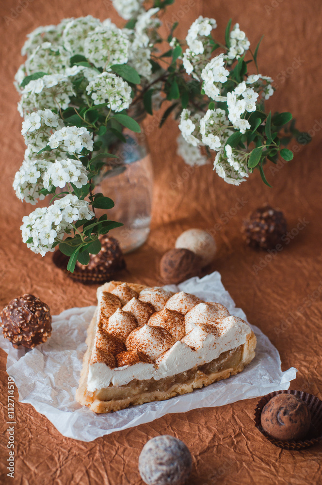 Fototapeta premium Apple pie with whipped cream covered by grated chocolate