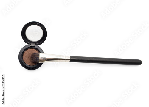 Eye shadow brush on brown eye shadow pot isolated on white background