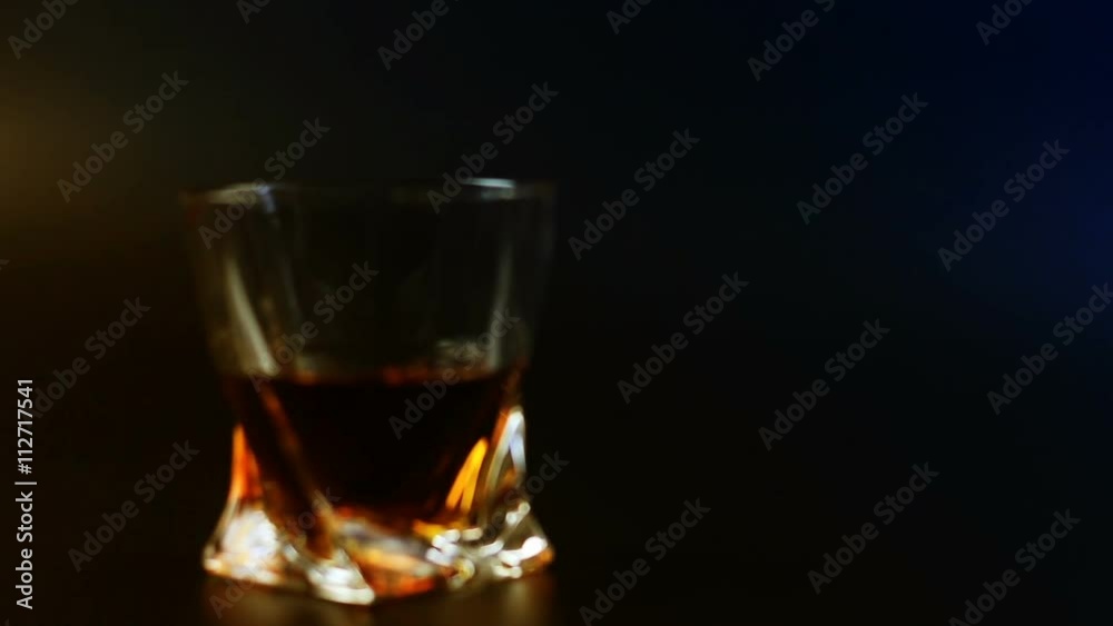 Man's drinking whiskey on black background Man's drinking whiskey on black background