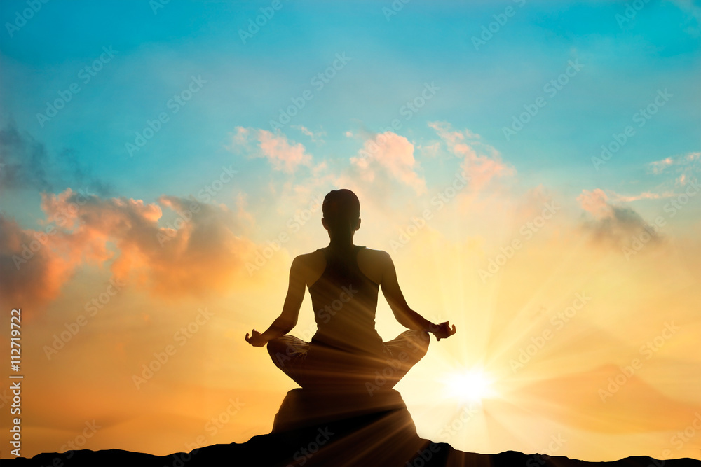 woman meditating pastel on high mountain in sunset background