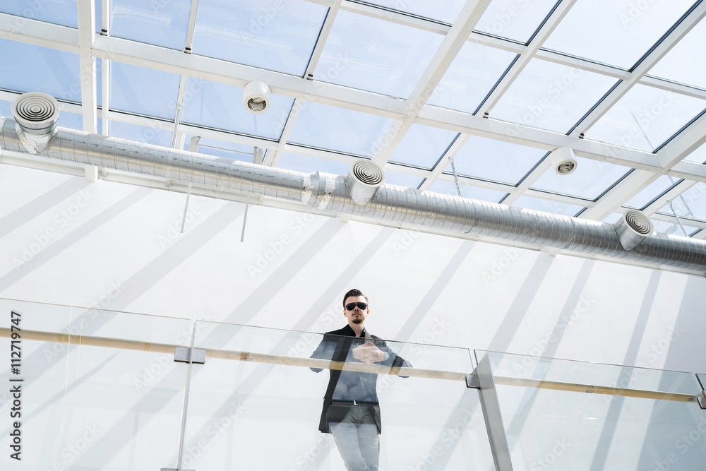 Businessman on balcony indoor
