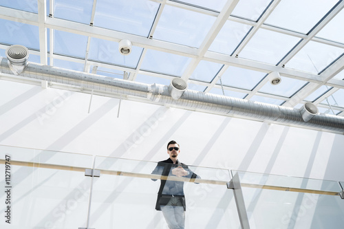 Businessman on balcony indoor © alexnope