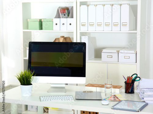 Designer working place with computer and paperwork © lenetsnikolai