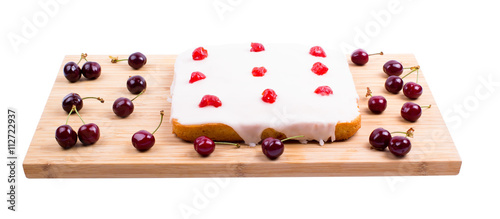 Square cake with cherry on