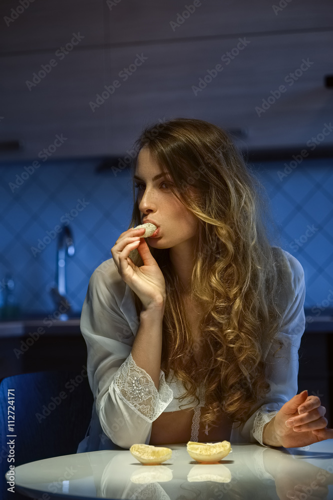 sexy girl in lingerie eating orange sexy girl in lingerie eating orange