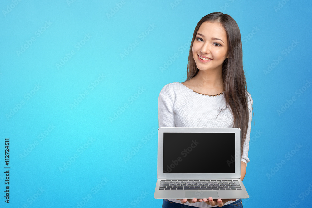 portrait of beautiful young woman holding laptop isolated portrait of beautiful young woman holding laptop isolated