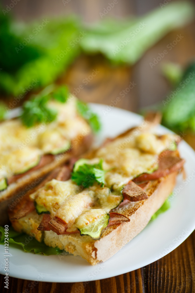 toast baked with sausage, cheese and cucumber