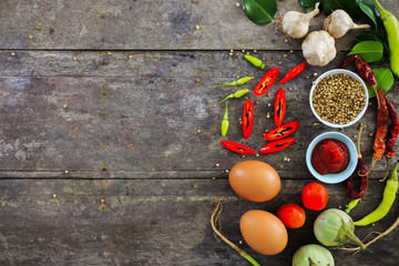 cooking concept, fresh kitchen herbs and spices on wooden table. top view and nature light [over light]