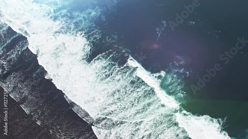 Cinematic style video. Wave and sunflares on Bali island, Indonesia.