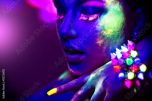 Fashion model woman in neon light, portrait of beautiful model girl with fluorescent make-up photo