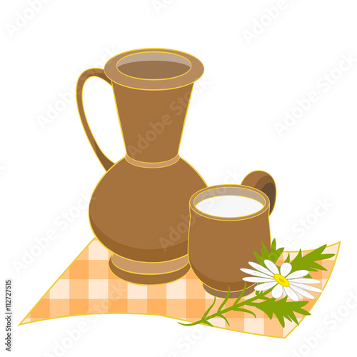 Jug and cup of milk on napkin