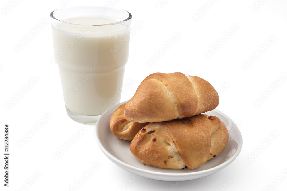 Fresh bavarian pastries rolls, on white plate with glass of yogurt, kifla kiflice, isolated on white background Fresh bavarian pastries rolls, on white plate with glass of yogurt, kifla kiflice, isolated on white background