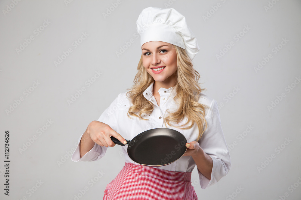 Portrait of smiling chef holding frying pan Portrait of smiling chef holding frying pan